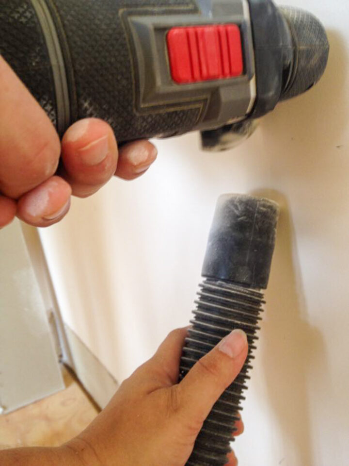 catching dust with a shop vac while cutting drywall