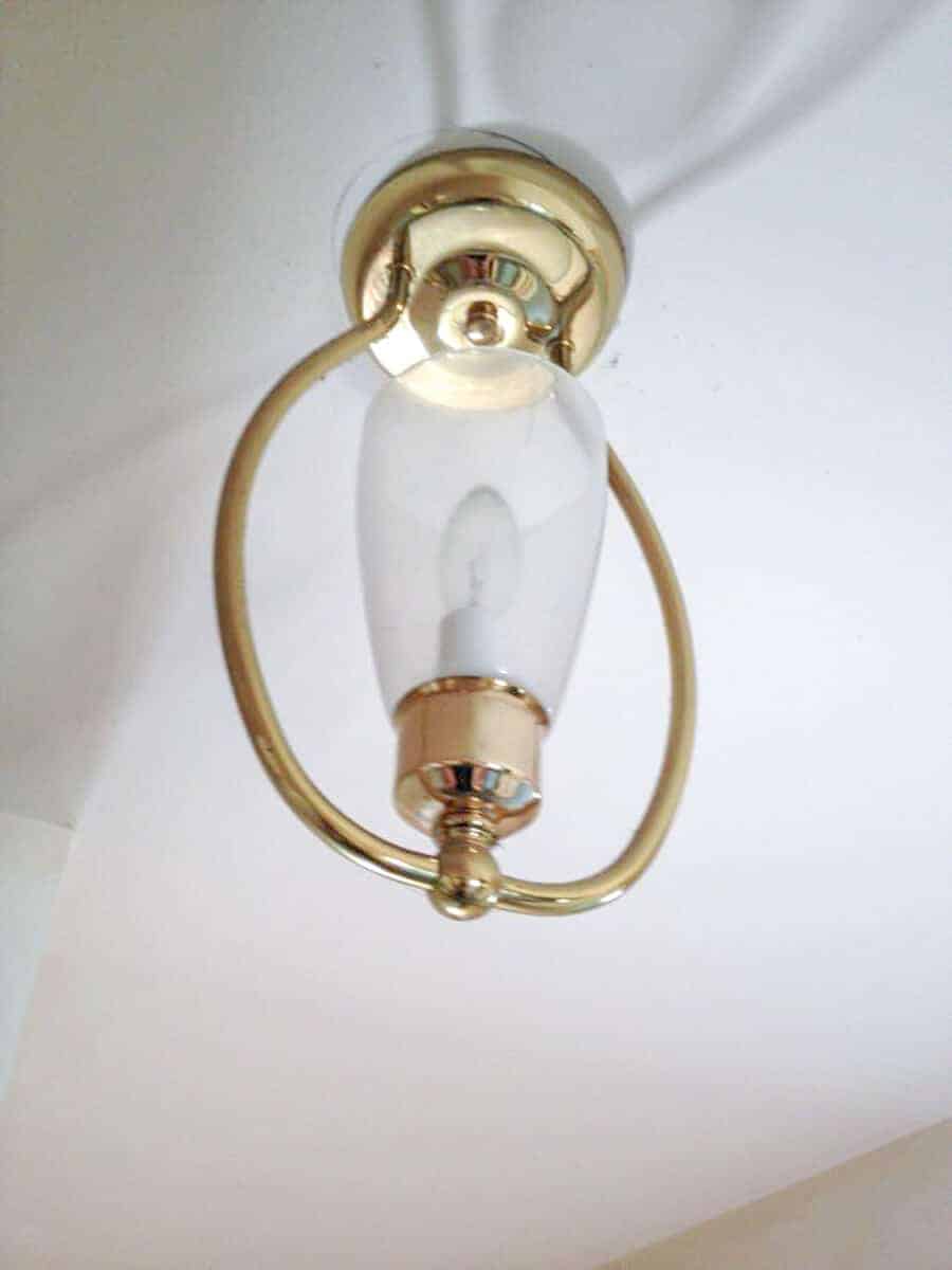 dated ceiling light hanging from ceiling