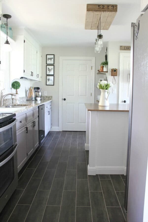 Our DIY Flooring only took 3 days and $400 to completely transform our kitchen with groutable Luxury Vinyl Tile.