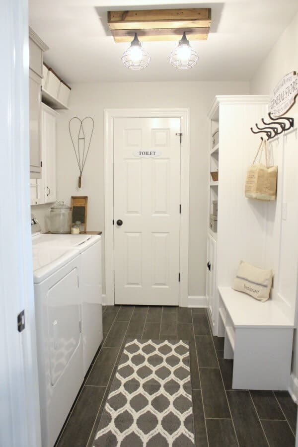 These homeowners transformed their dated laundry room into a gorgeous, vintage inspired laundry room! I love the drying rack!