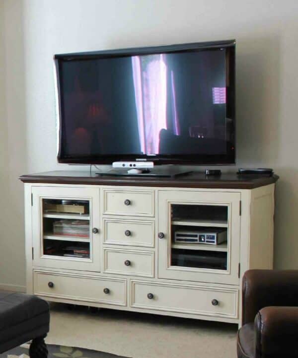 Easy Entertainment Center Makeover: I love how this blogger took a dated entertainment center that no longer matched her decor and updated it into a stunner!