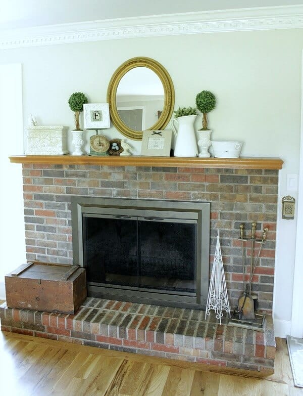 Painting a brick fireplace: How we are slowly making over our fireplace.