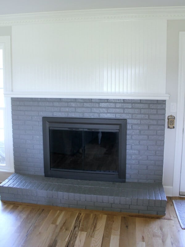 Painting a brick fireplace: How we are slowly making over our fireplace.