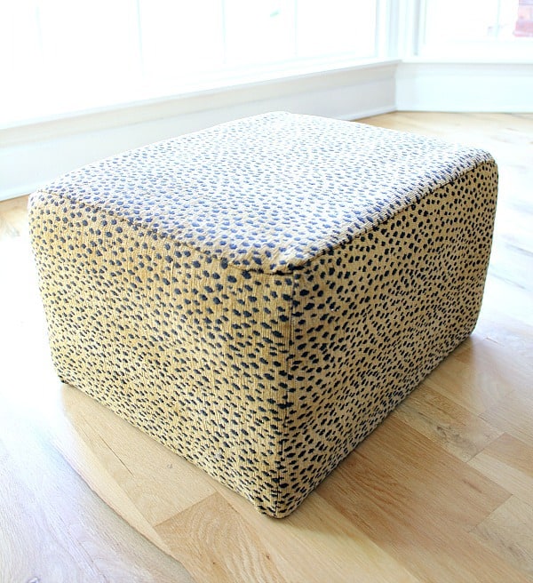 Reupholstered Ottoman: This blogger was given an ugly ottoman and she turned it into a gorgeous accessory for her armchair.