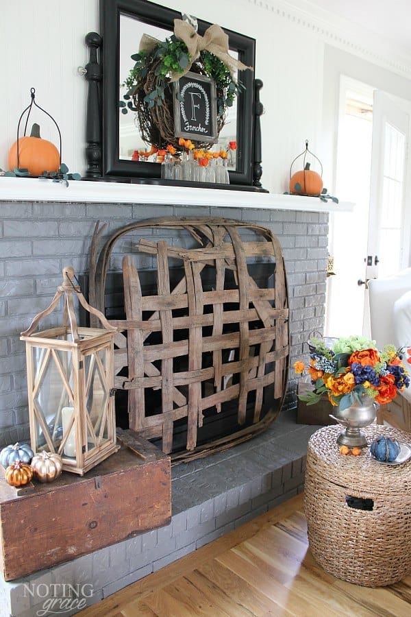 Cozy Fall Farmhouse Decor in Navy and Orange - the hottest color of the year is navy. Here's how to incorporate this cozy color in your fall decor.