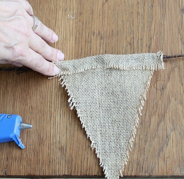 Easy Fall Bunting Tutorial: hot glue the burlap to the floral wire