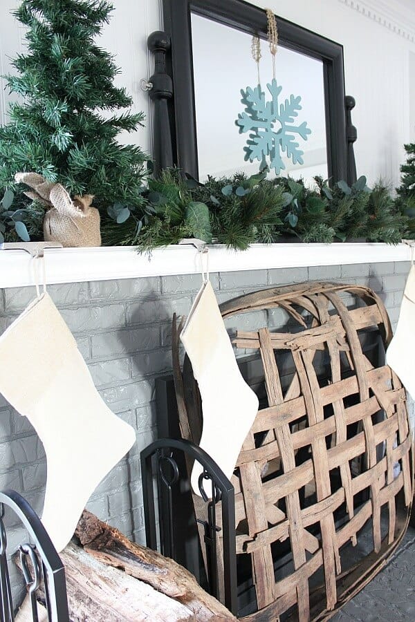 Simple Farmhouse Christmas Mantel - Creating a cozy space with farmhouse simplicity for this holiday season.