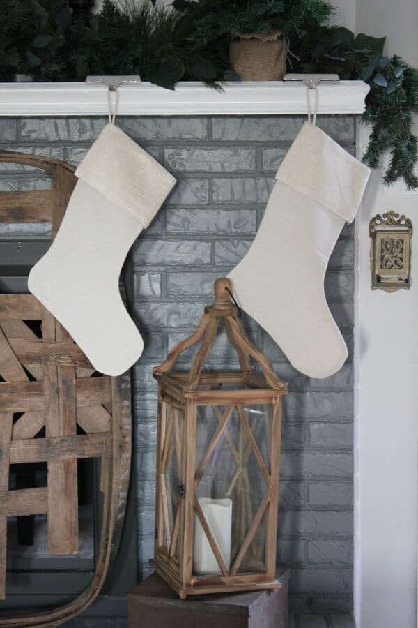 Simple Farmhouse Christmas Mantel - Creating a cozy space with farmhouse simplicity for this holiday season.