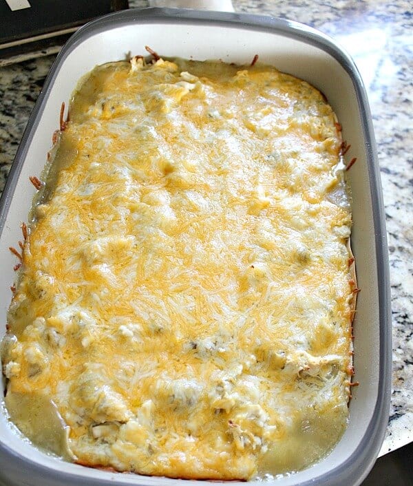 Stop rolling those Enchiladas! With this Cheesy Chicken Enchilada bake - you'll save time and energy creating a family favorite dish. Plus this is great for last minute meals! This is a recipe you definitely want to try!