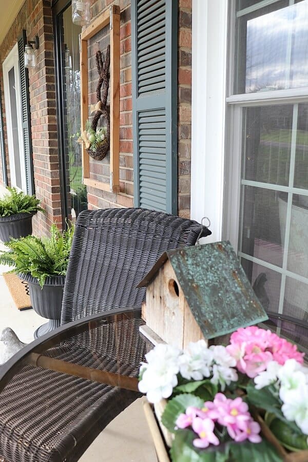 You can create a fun seasonal porch with just a few items in no time. This easy spring porch decor has transformed my wintry porch into a spot to watch the flowers bloom!