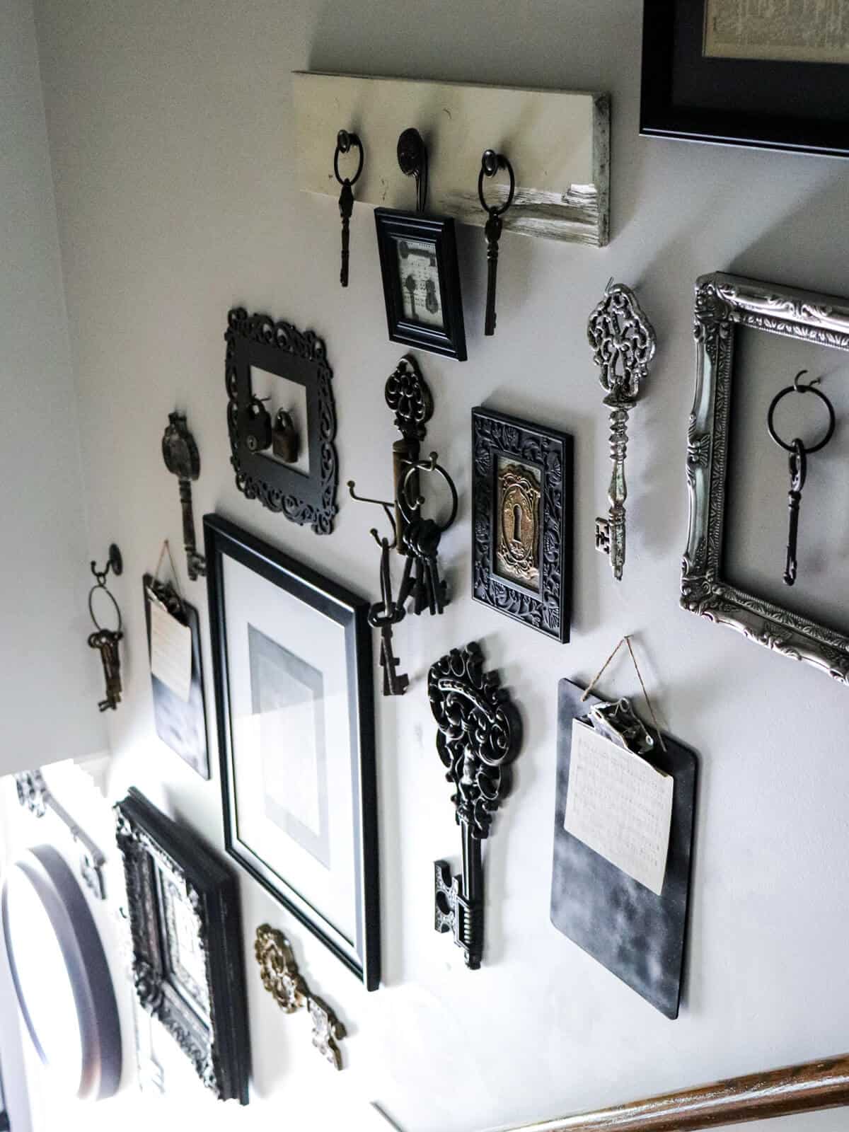 black white and silver key gallery wall on a stairway