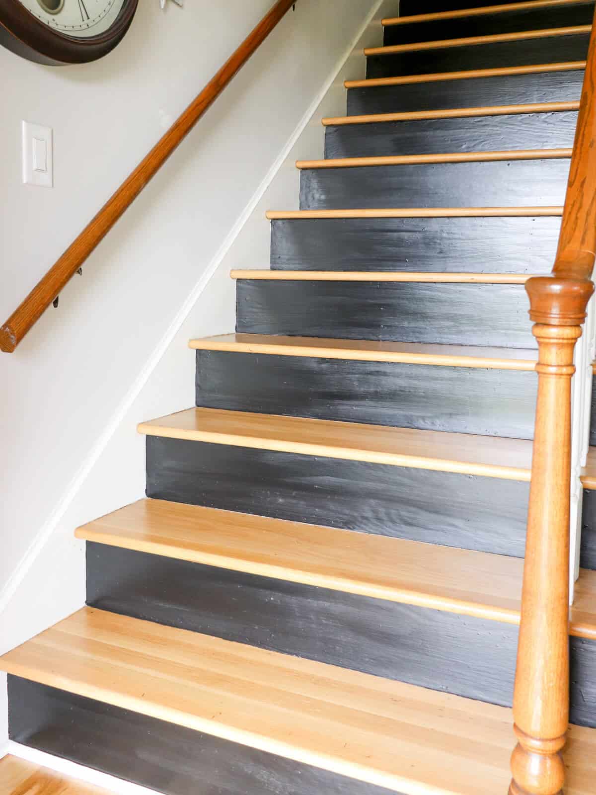 staircase with wood treads and risers getting painted black