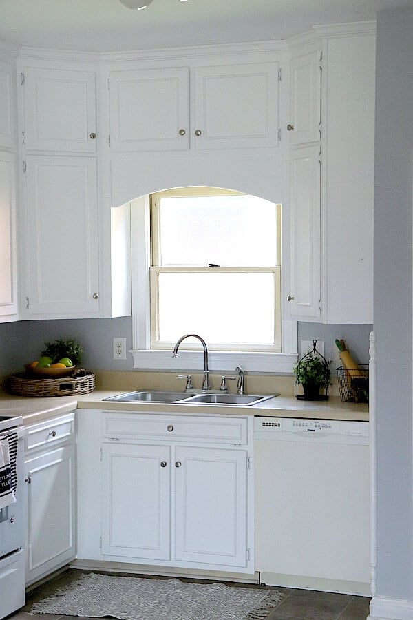 Painting Kitchen Cabinets White - we took nicotine stained cabinets from our friend's rental and made them look brand new with a coat of paint
