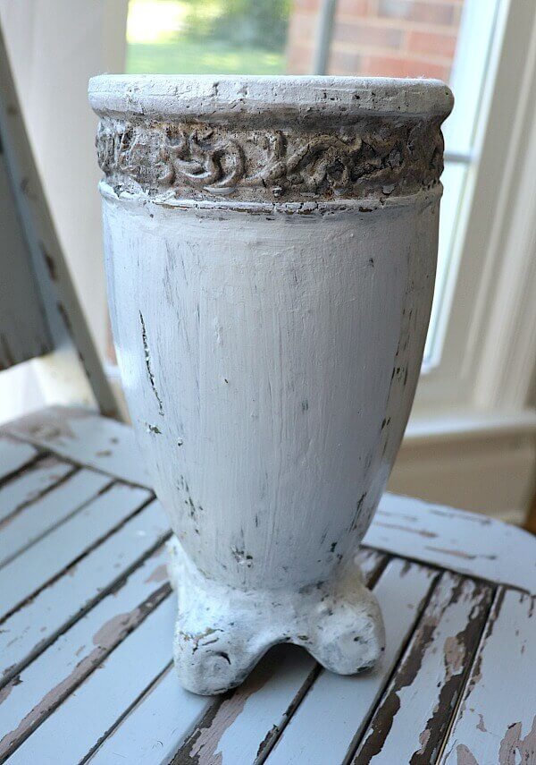 Create your own DIY rusted Cast Iron planter with this tutorial. We took an old ceramic planter and turned it into a vintage looking urn.