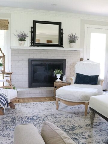 Limewashing a Painted Brick Fireplace - how we transformed our ugly and dated brick fireplace into a gorgeous focal point.
