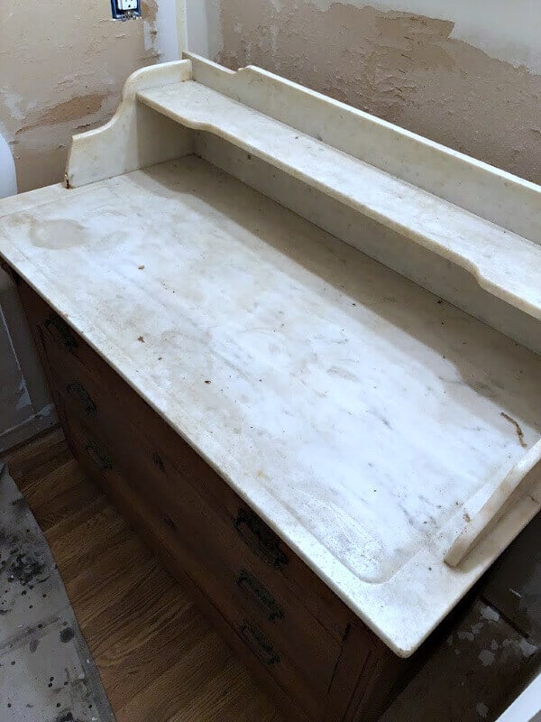 We found a forgotten item tucked away in someone's basement and turned it into something fabulous! Here's how we made our Vintage Washstand turned Bathroom Vanity for our master bathroom makeover.