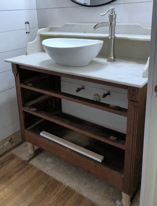 We found a forgotten item tucked away in someone's basement and turned it into something fabulous! Here's how we made our Vintage Washstand turned Bathroom Vanity for our master bathroom makeover.