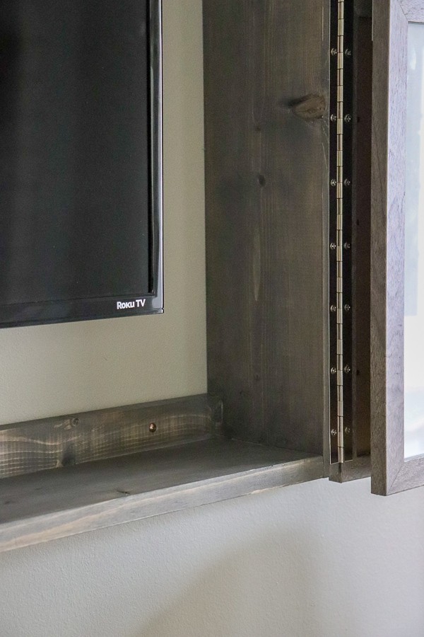 DIY wall cabinet built to hide your TV