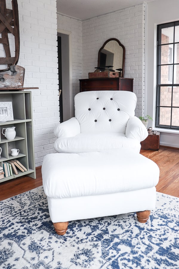 When I found a chair for $35 on a buy/sell/trade site, I knew I could flip the chair into something perfect for my home. Here's an easy DIY reupholstered chair and ottoman that took just a few days to complete.
