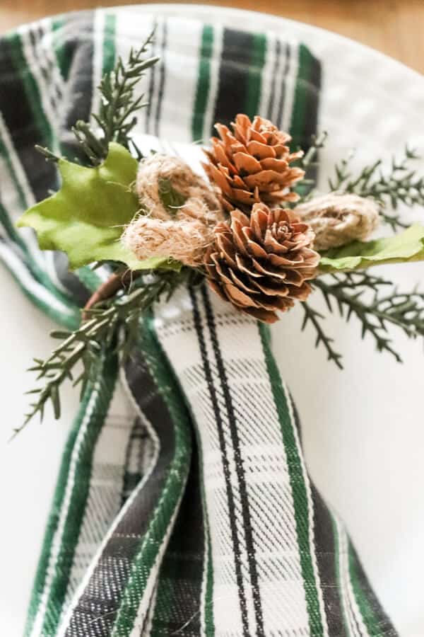Casual Black White and Green Christmas Tablescape napkin ring close up