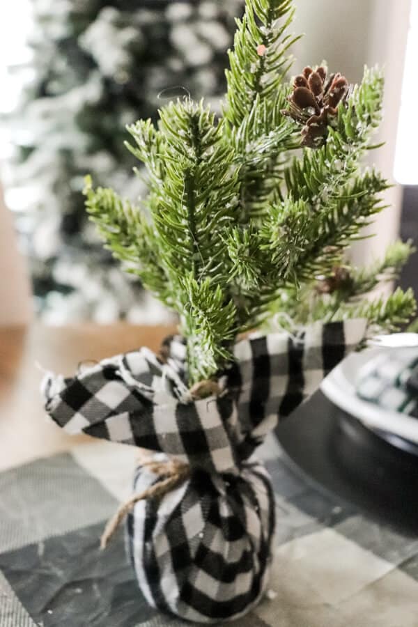 Casual Black White and Green Christmas Tablescape mini tree bokeh
