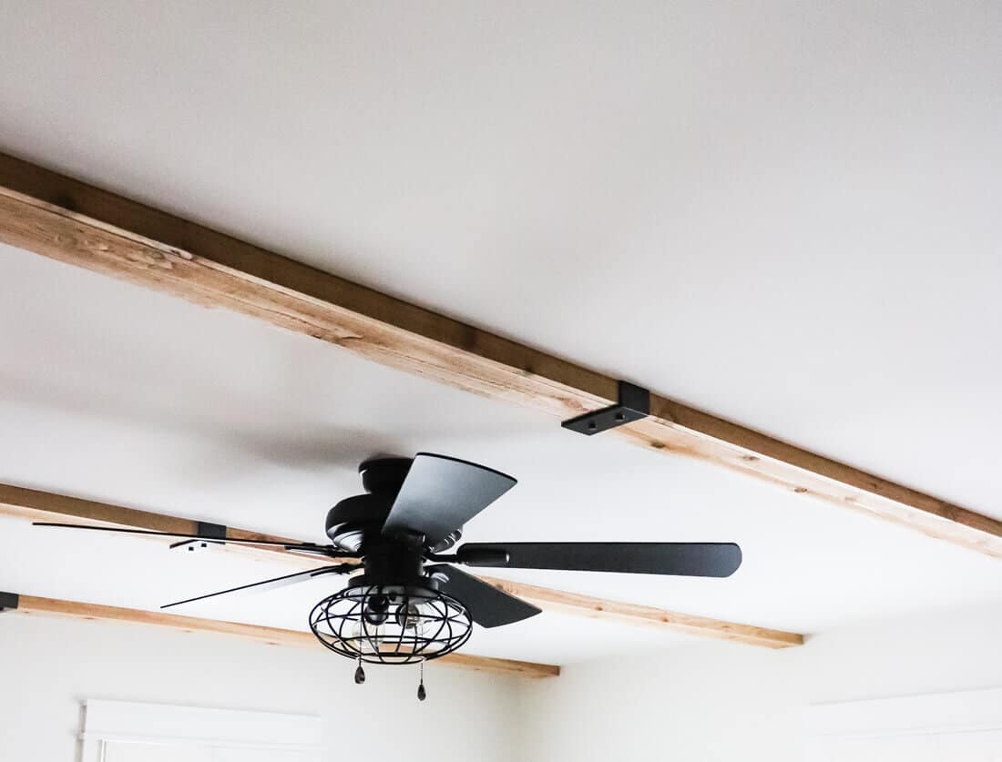 cedar ceiling beams with industrial feel ceiling fan