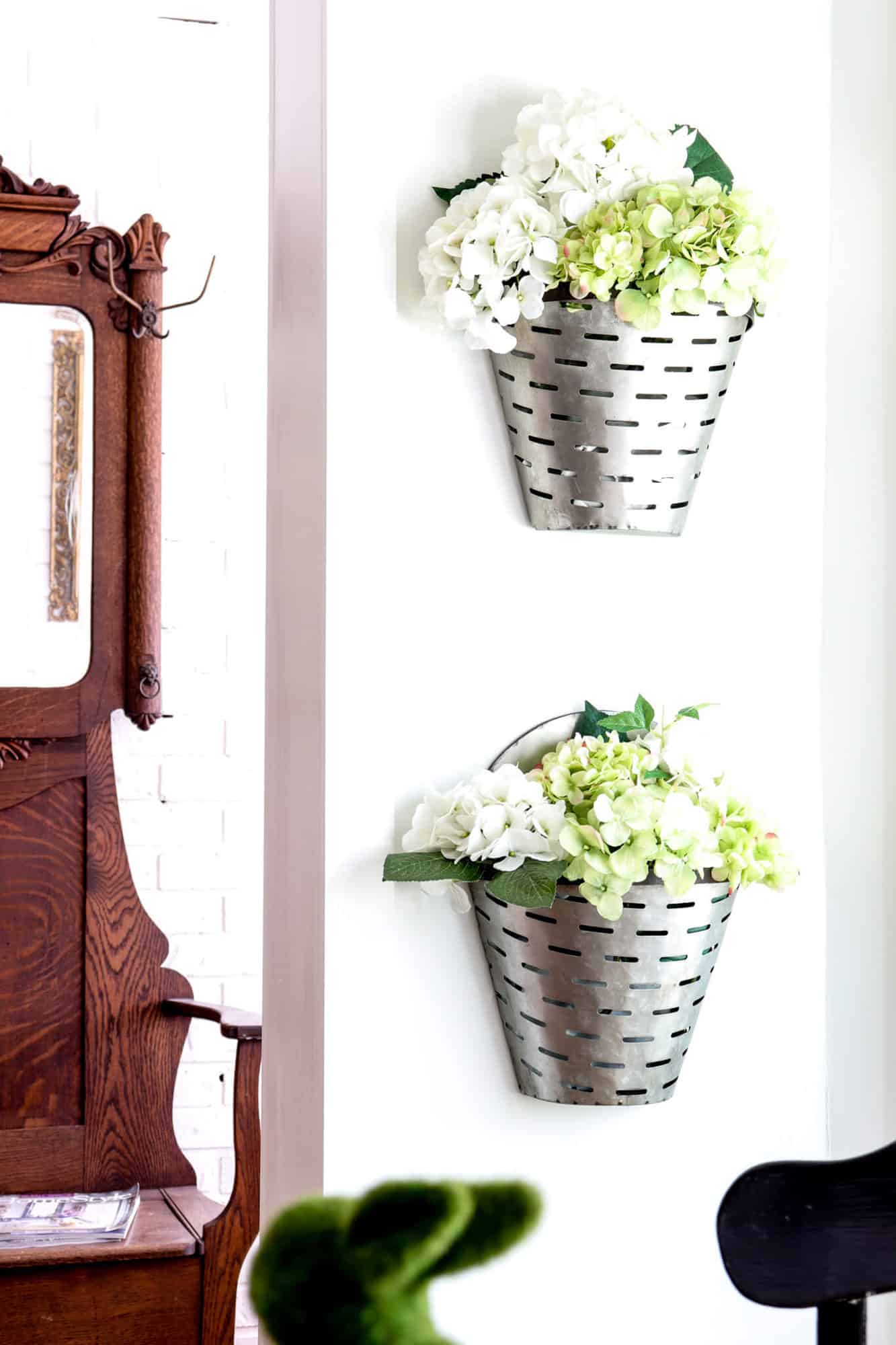 olive wall buckets filled with faux hydrangeas