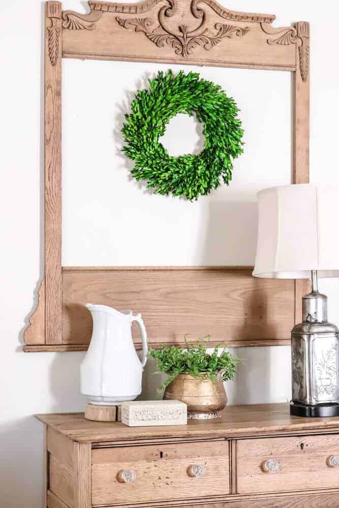 old dresser mirror repurposed as a architectural wall hanging