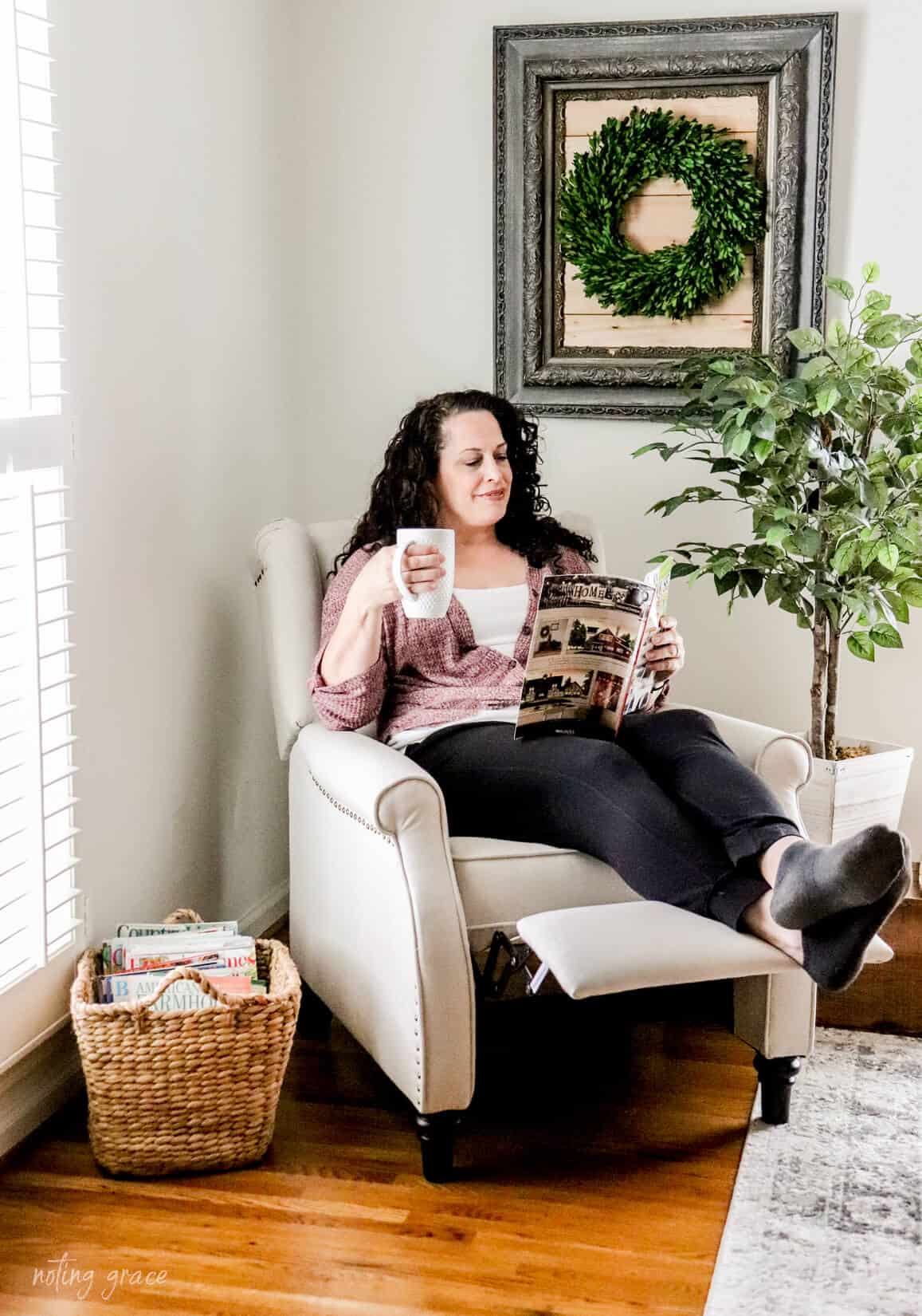 woman in recliner drinking coffee