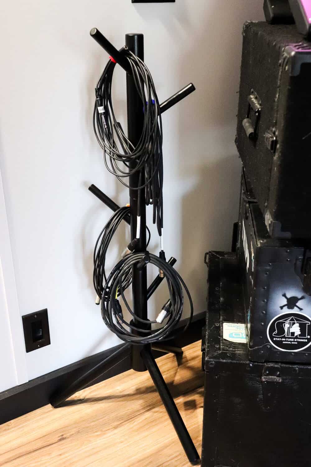 using a hat rack as a cord organizer