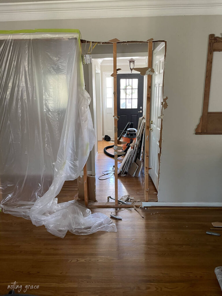 We needed to let more light shine in to our living room and there was just one obstacle keeping that from happening. This wall in our entryway needed to go! Here's how to remove an interior wall.
