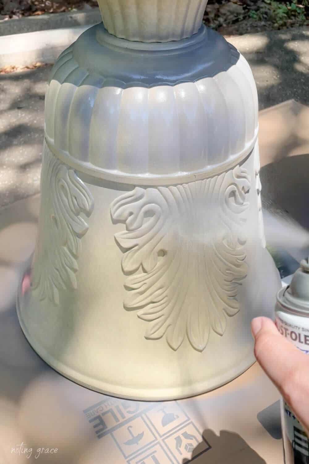 spray painting a plastic planter