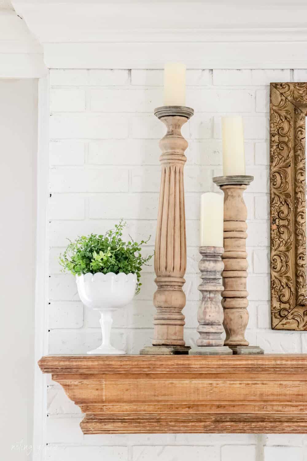 DIY candlesticks on fireplace mantel