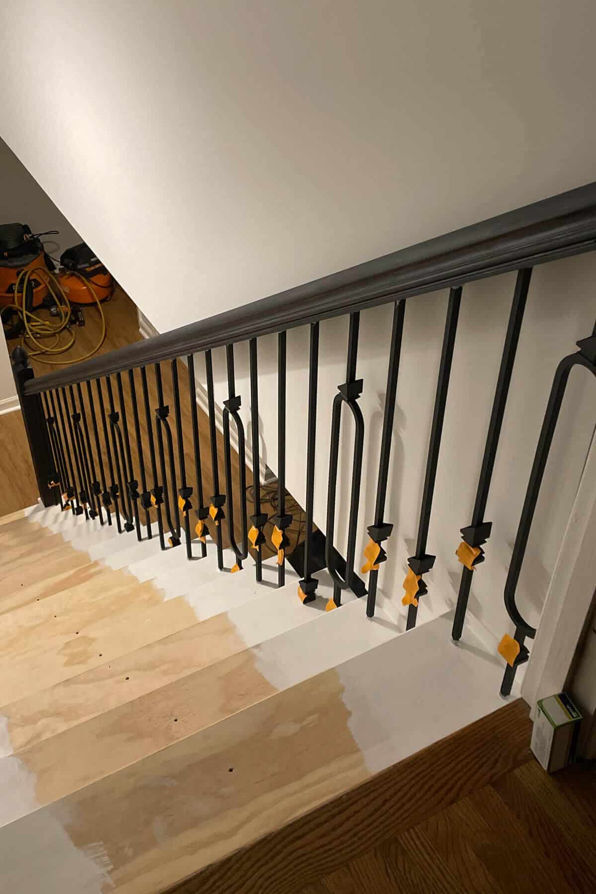 painted stair tread and iron balusters