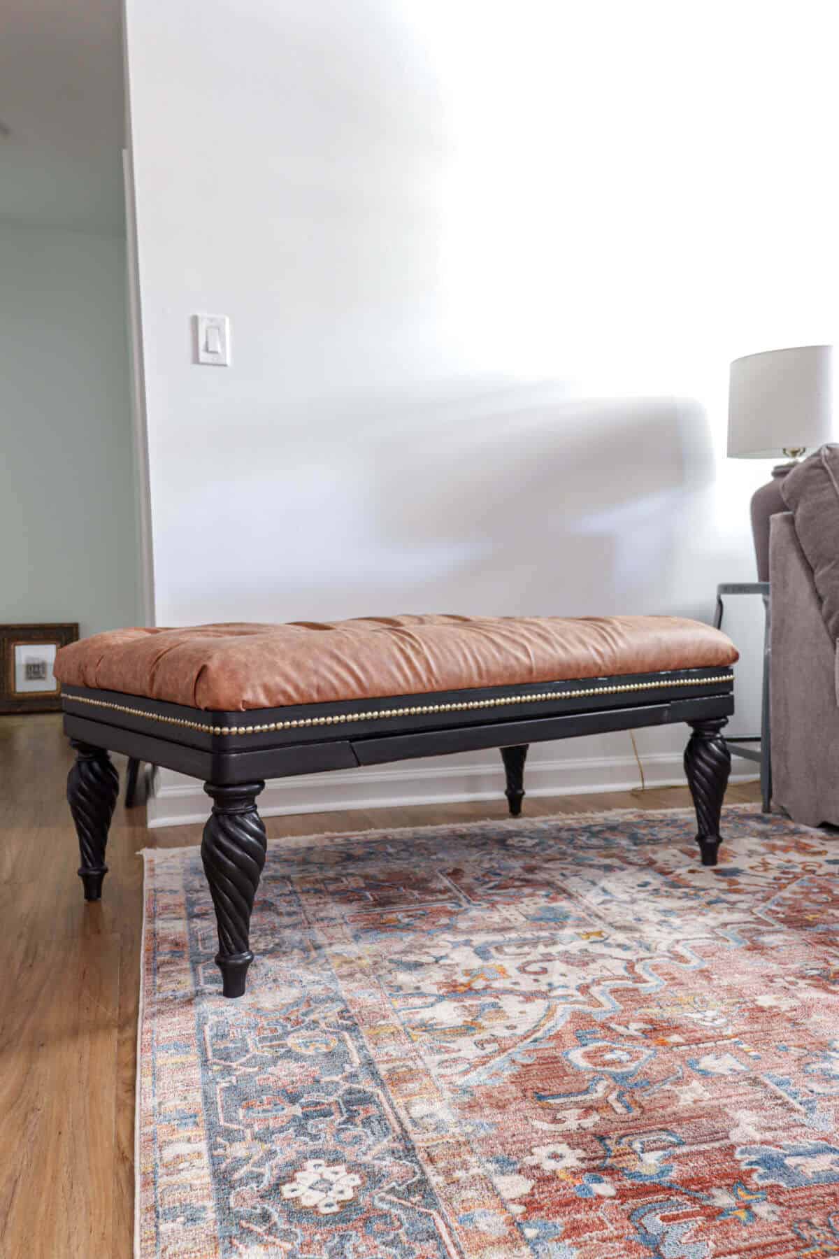 Tufted reupholstered ottoman
