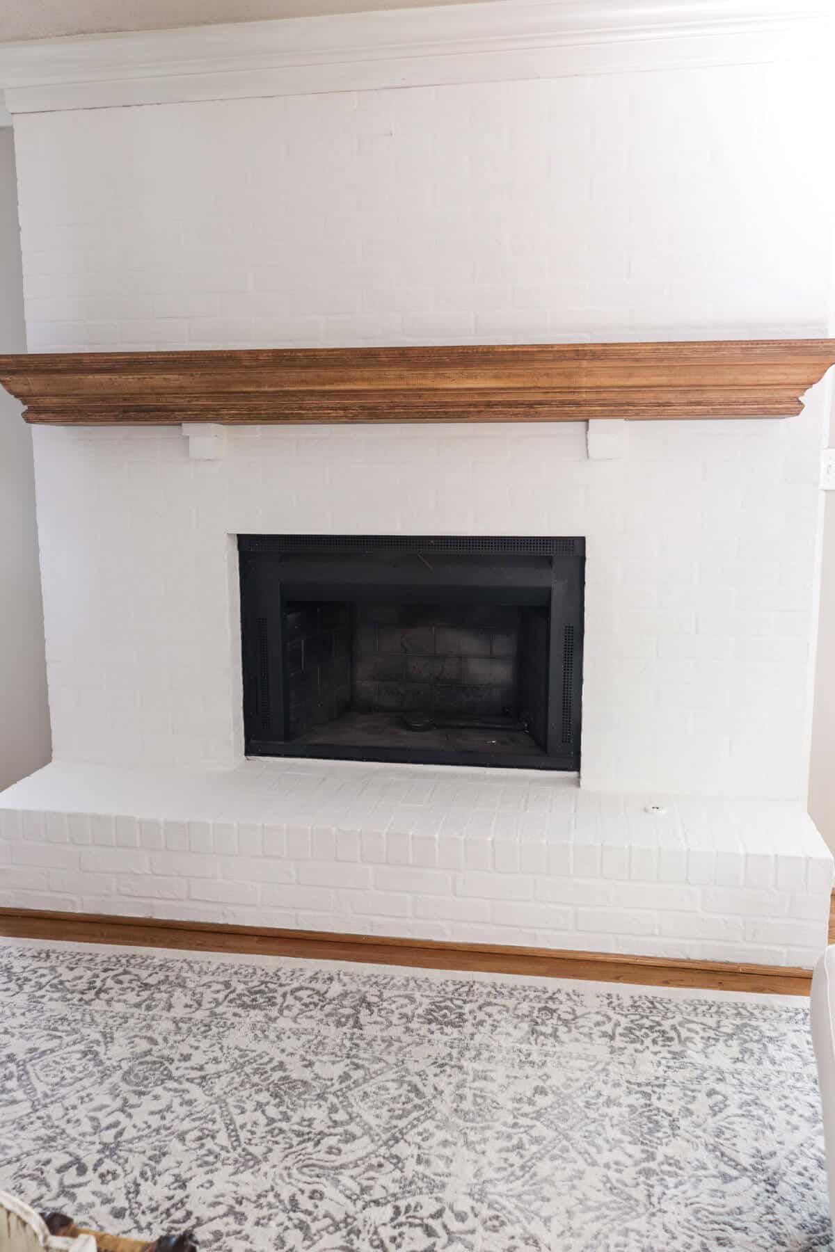 White fireplace with Romabio Lime Slurry in Grace Note