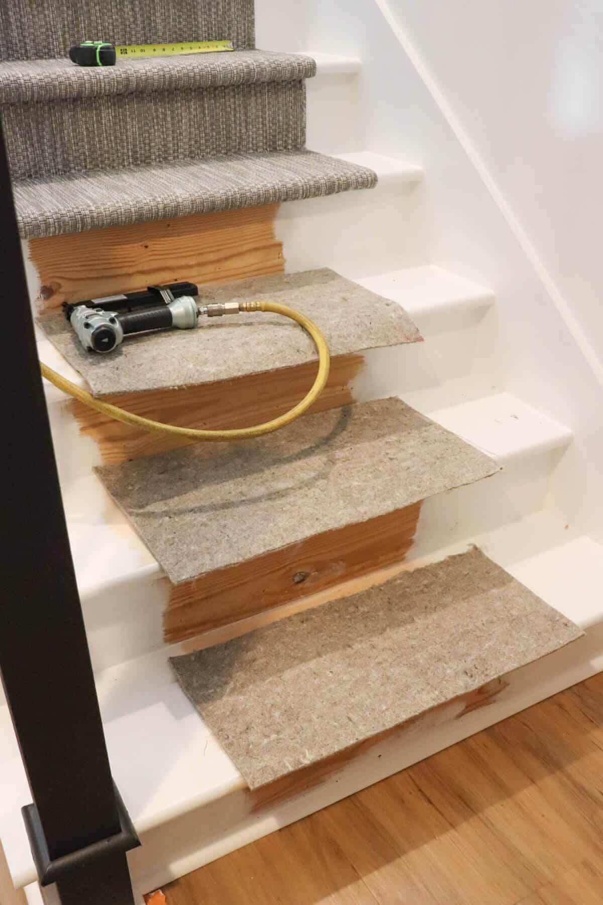 stopping halfway down a carpet runner stairway