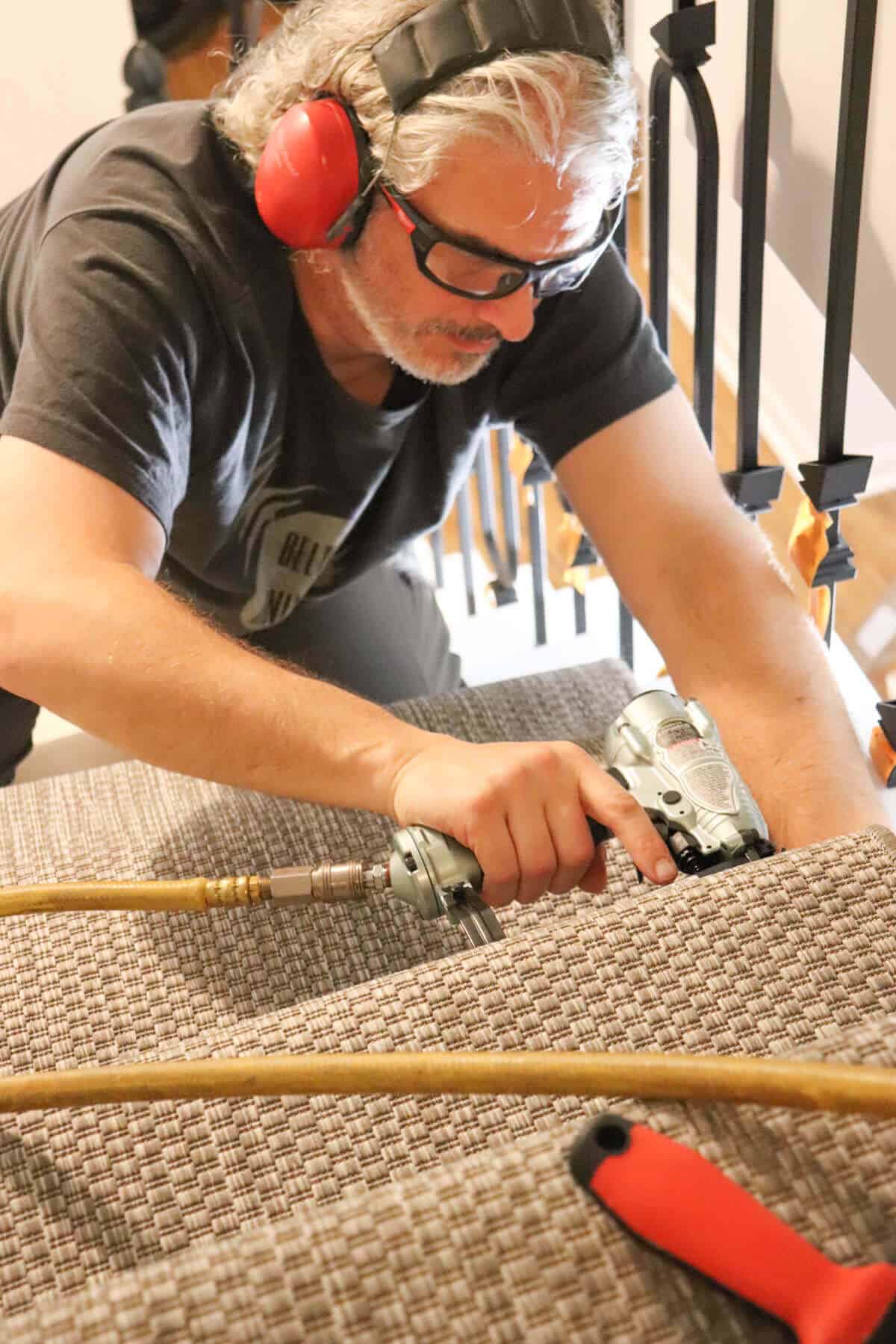 installing carpet runner with a pneumatic crown stapler