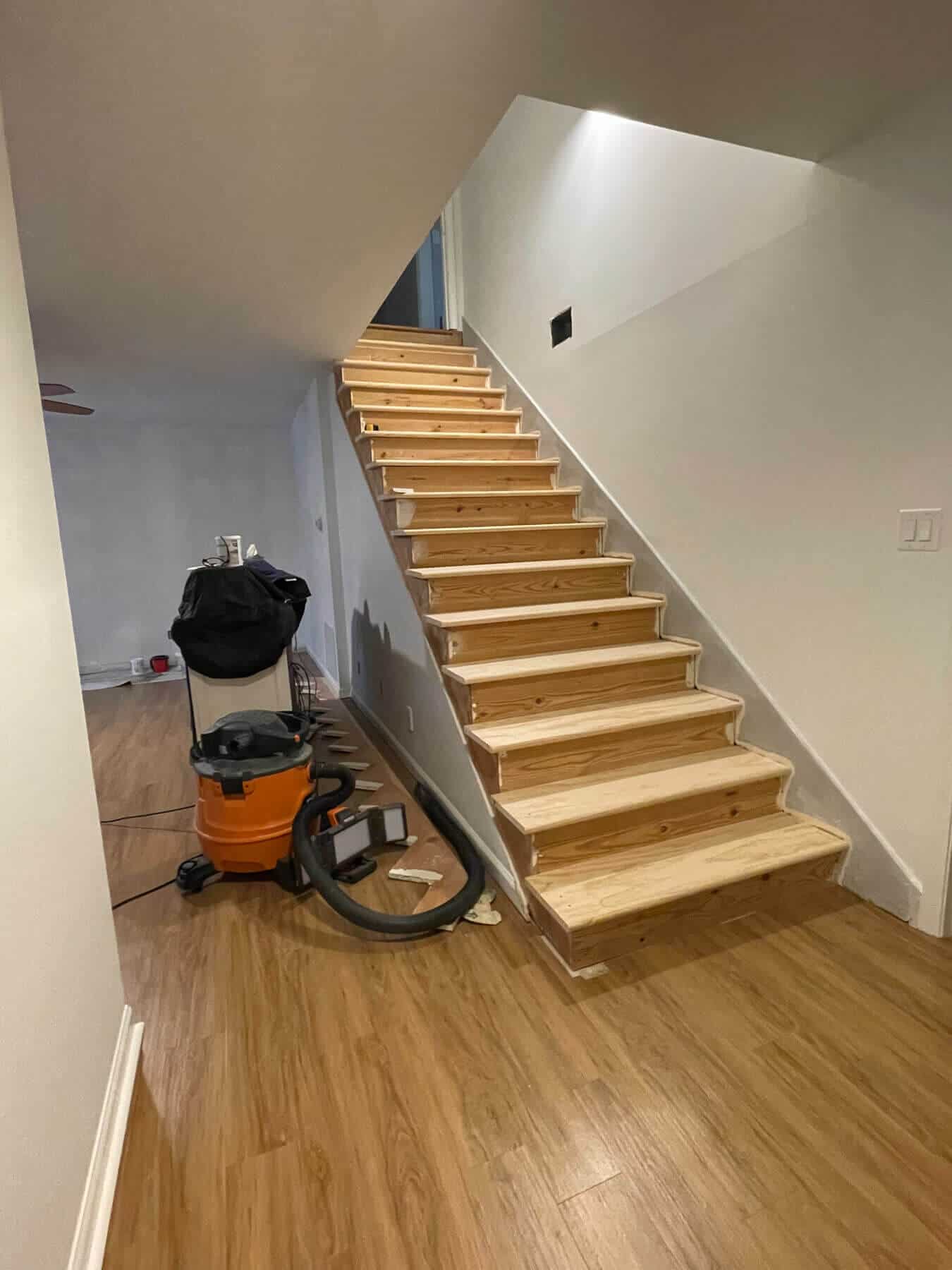 new stair treads installed on a basement staircase