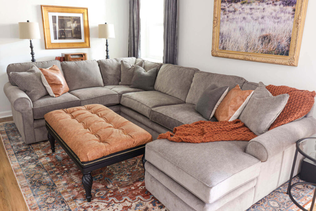 Gray Collins La-Z-Boy sectional with rust colored accent decor