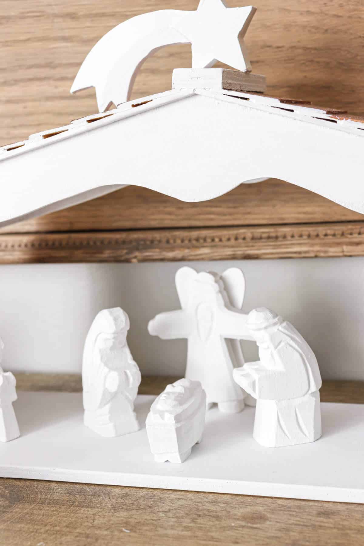 wooden nativity scene painted white