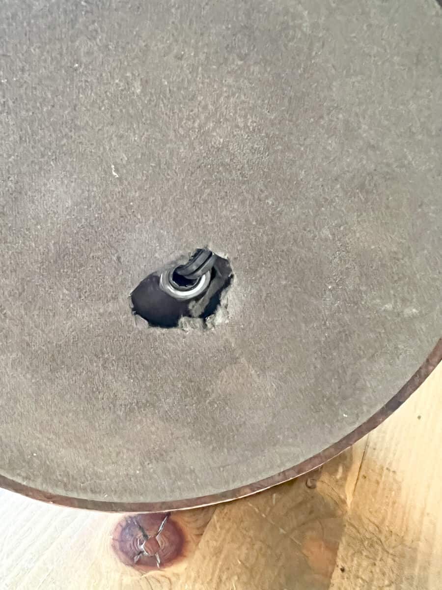 bottom of a lamp with a hole cut out.