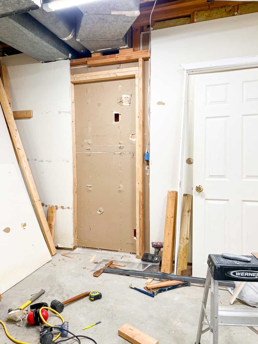 framing a wall to cut into the wall to prepare for hanging an interior door