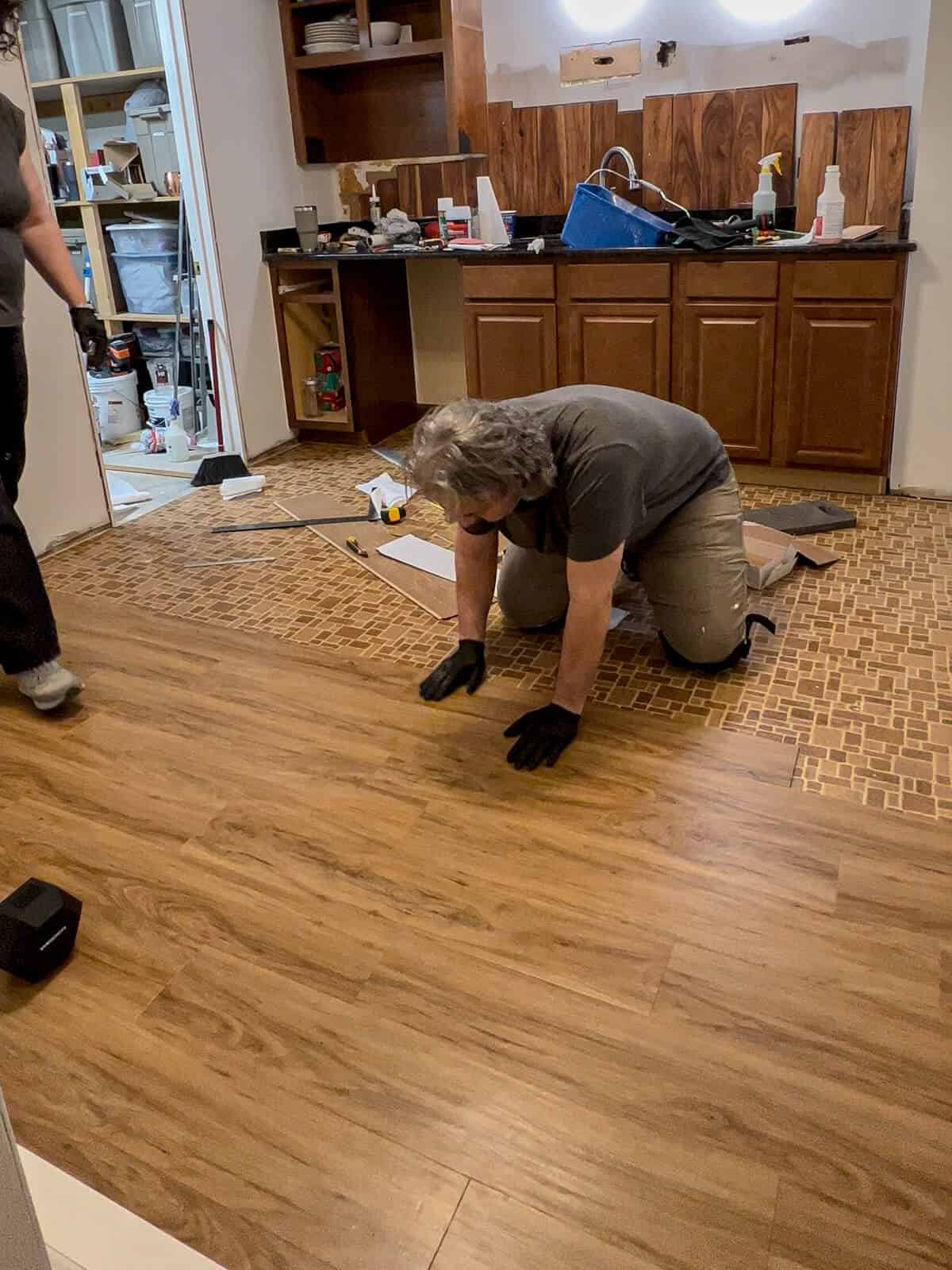 old linoleum floor getting a luxury vinyl tile installed over top