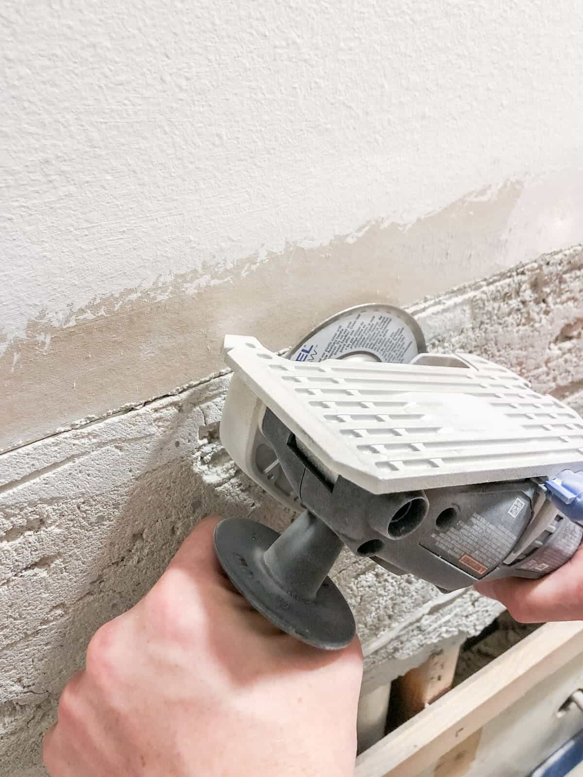 Dremel ultras grinding away old grout