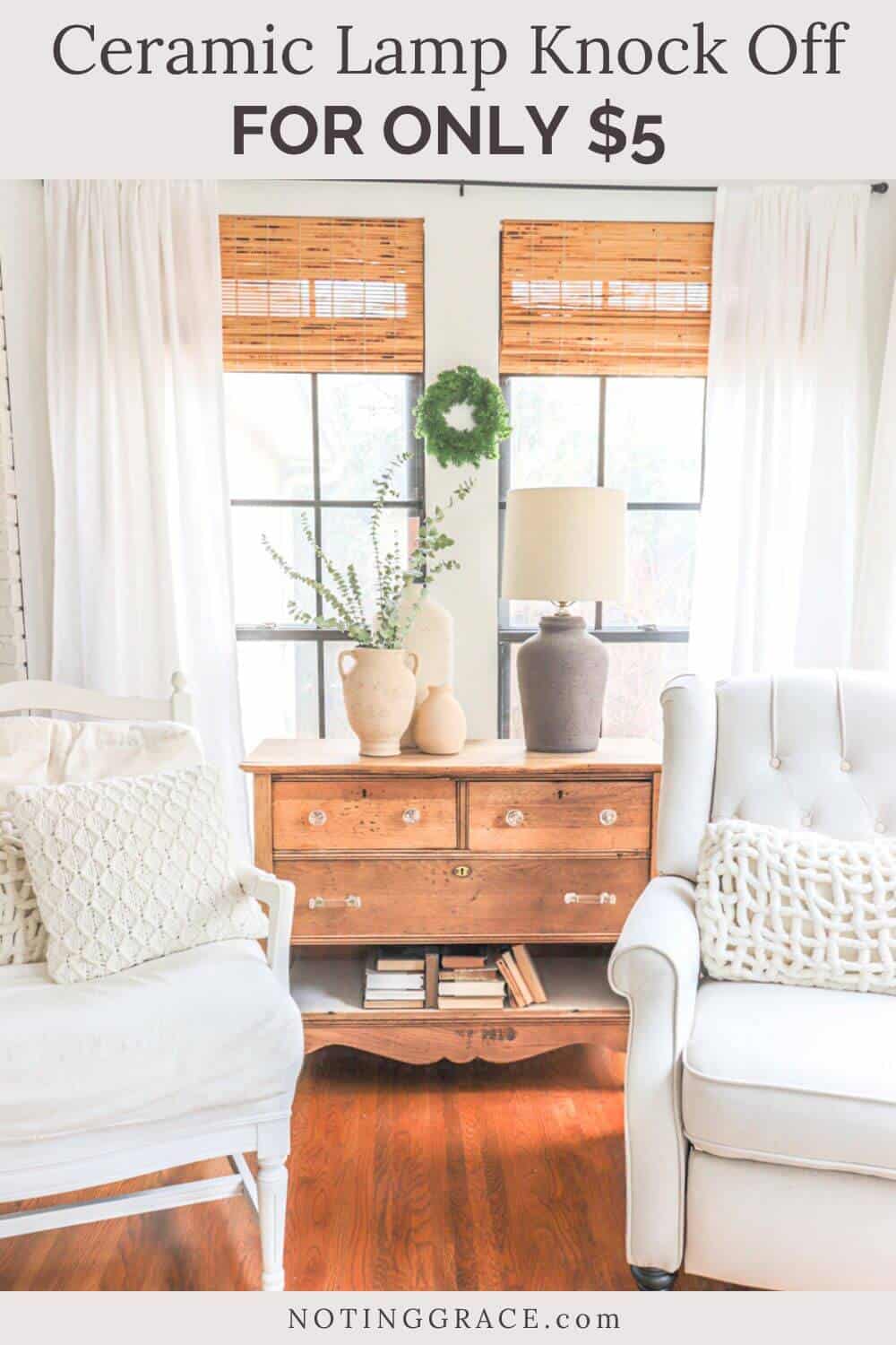 view of sunroom with an unfinished dresser, two white armchairs and textured vases and lamp on top of the dresser