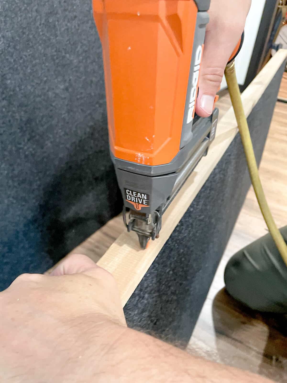 nailing cedar trim pieces to a wall panel