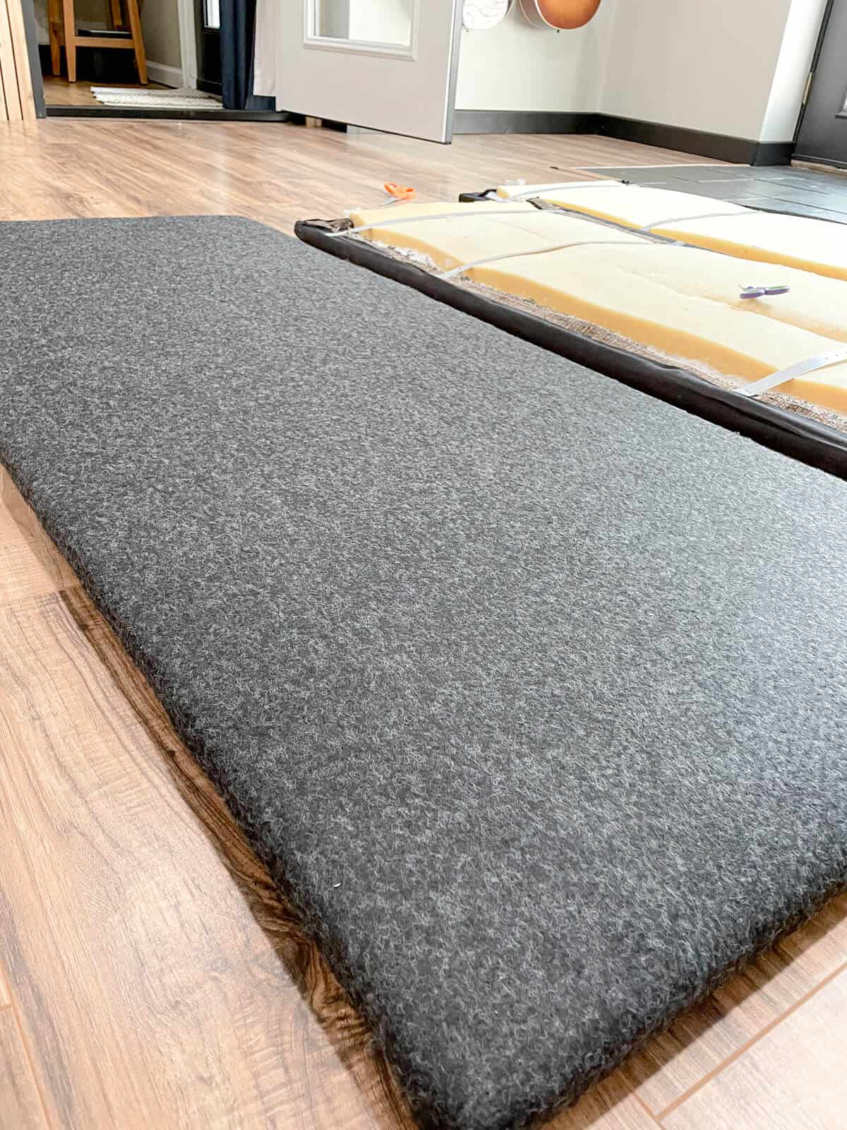 wall panels covered in charcoal felt