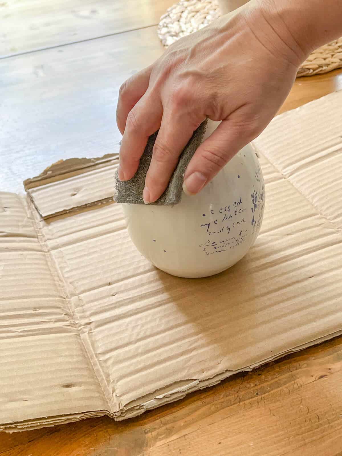 scuffing a clearance vase to prepare for painting