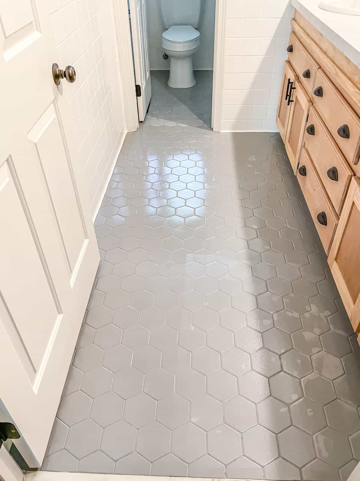 clear coat drying on painted tile bathroom floor